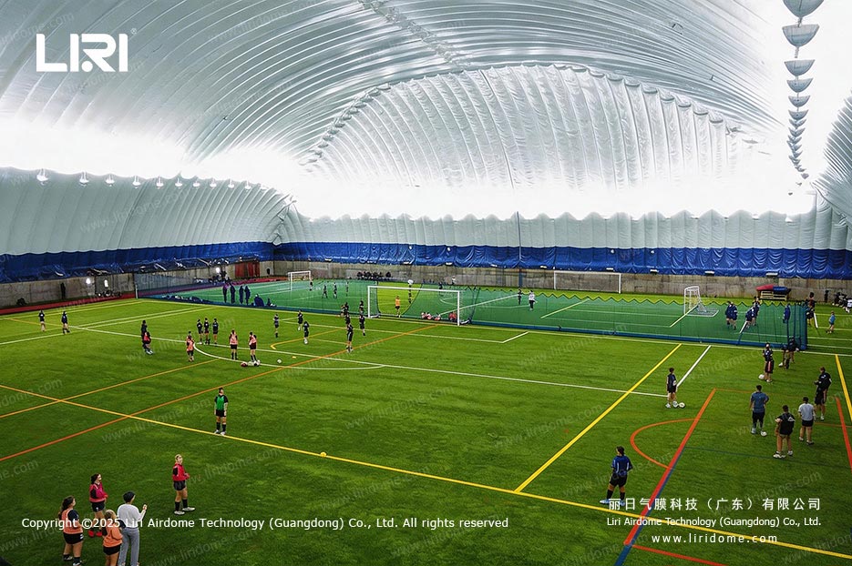 Players training on multiple pitches inside a football air dome