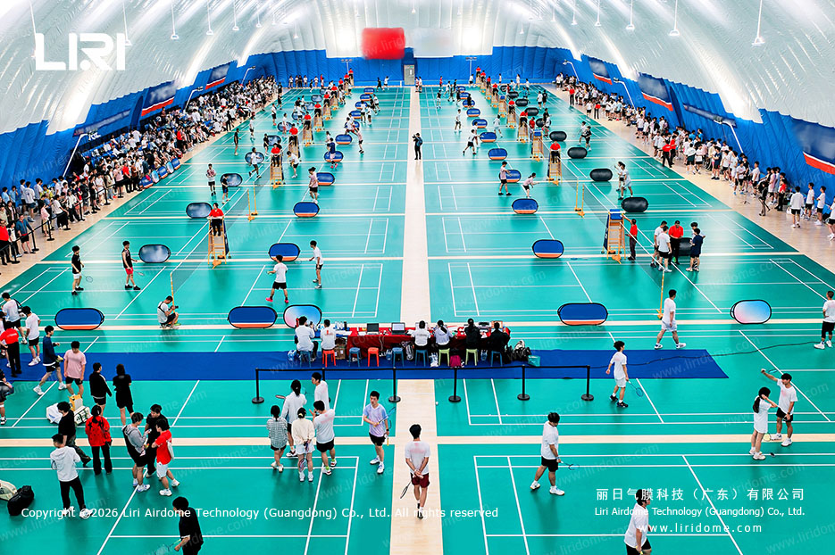 Campus air dome with multiple badminton courts and spectators for school sports events