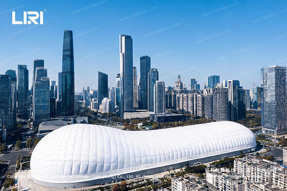 Urban indoor ski resort air dome exterior surrounded by city buildings