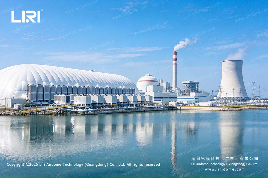 Air dome and exterior cooling equipment beside a waterfront industrial facility